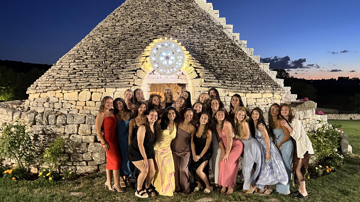 Group of dancers outside at night