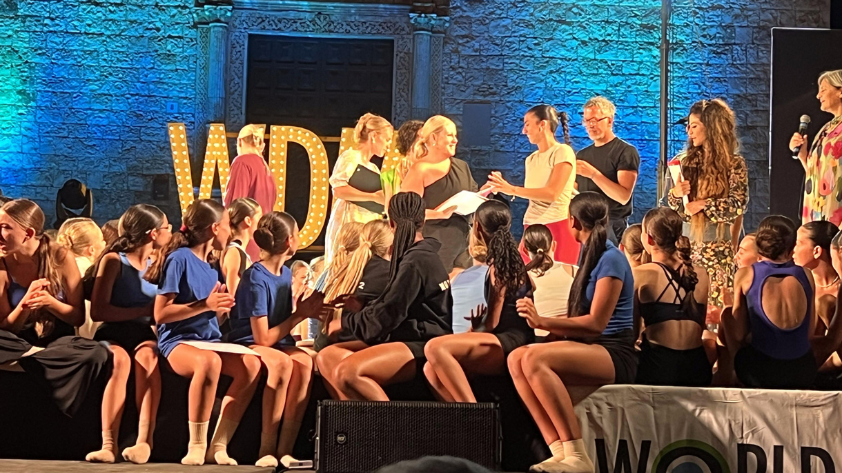 Dancer accepting award on stage