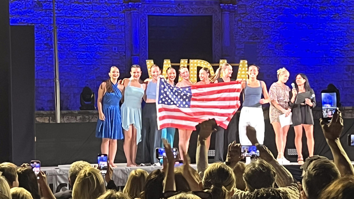 Dancers holding American flag