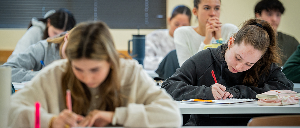 Students taking notes in class