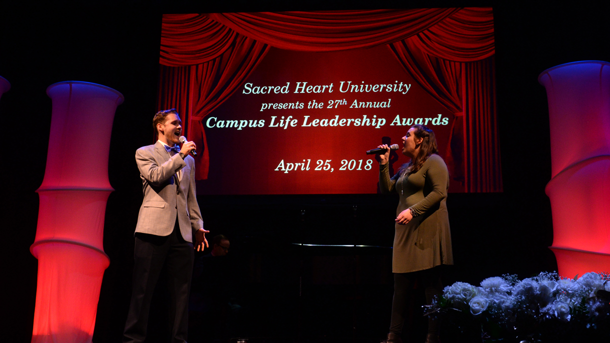 Michaela Vieira and Cory Robinson singing