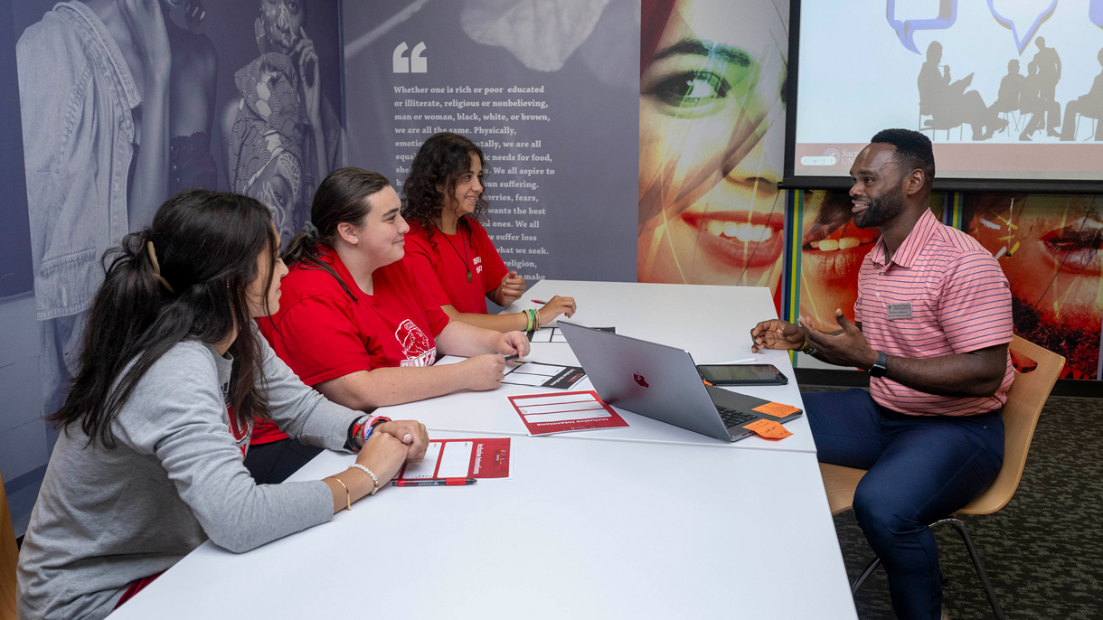 Students and staff talking in the Multicultural Center
