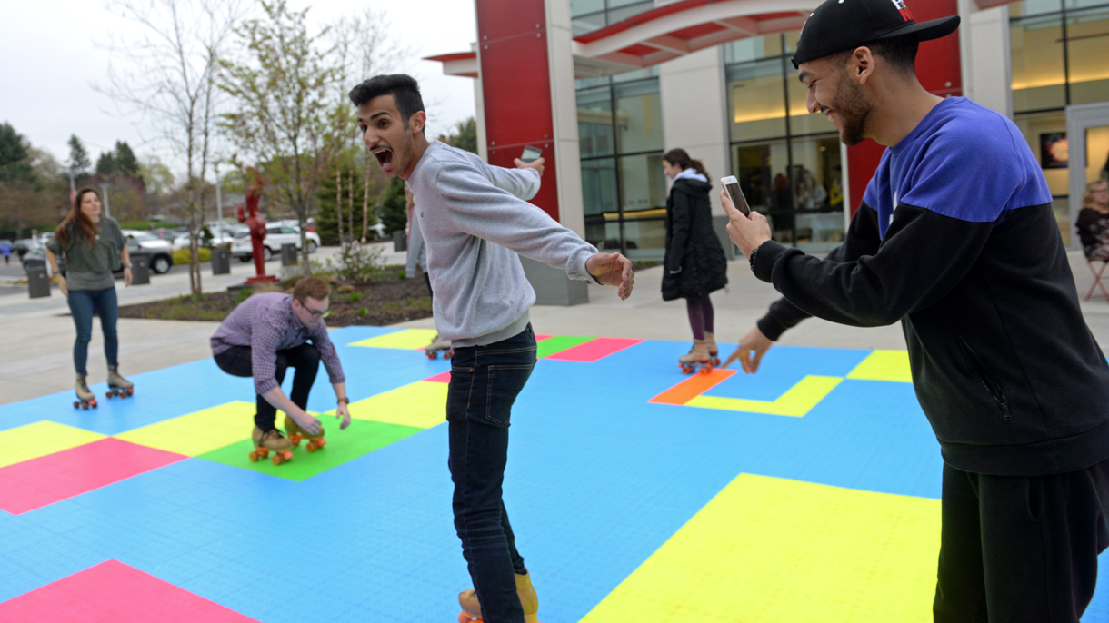 Students roller skating outside