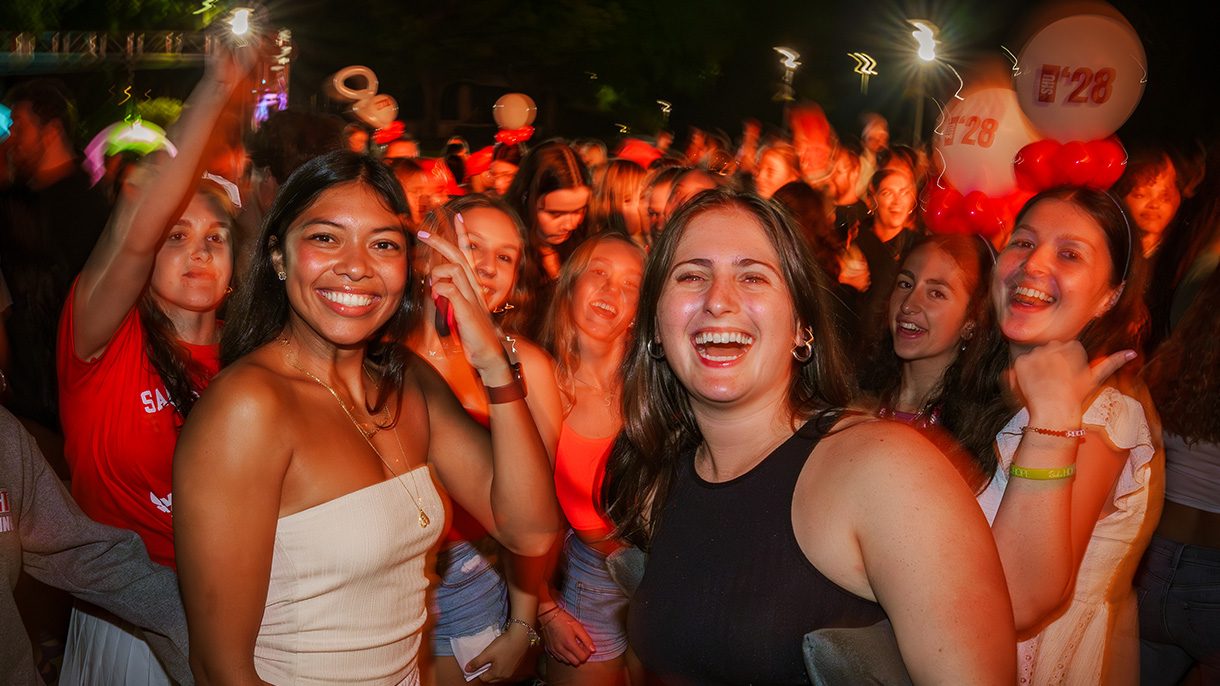 People laughing in a large crowd