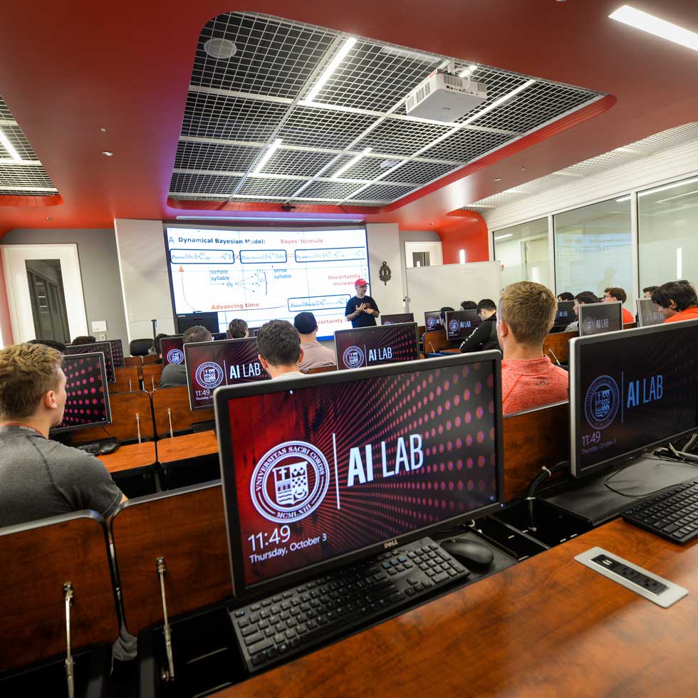 Students listening to professor in AI Lab