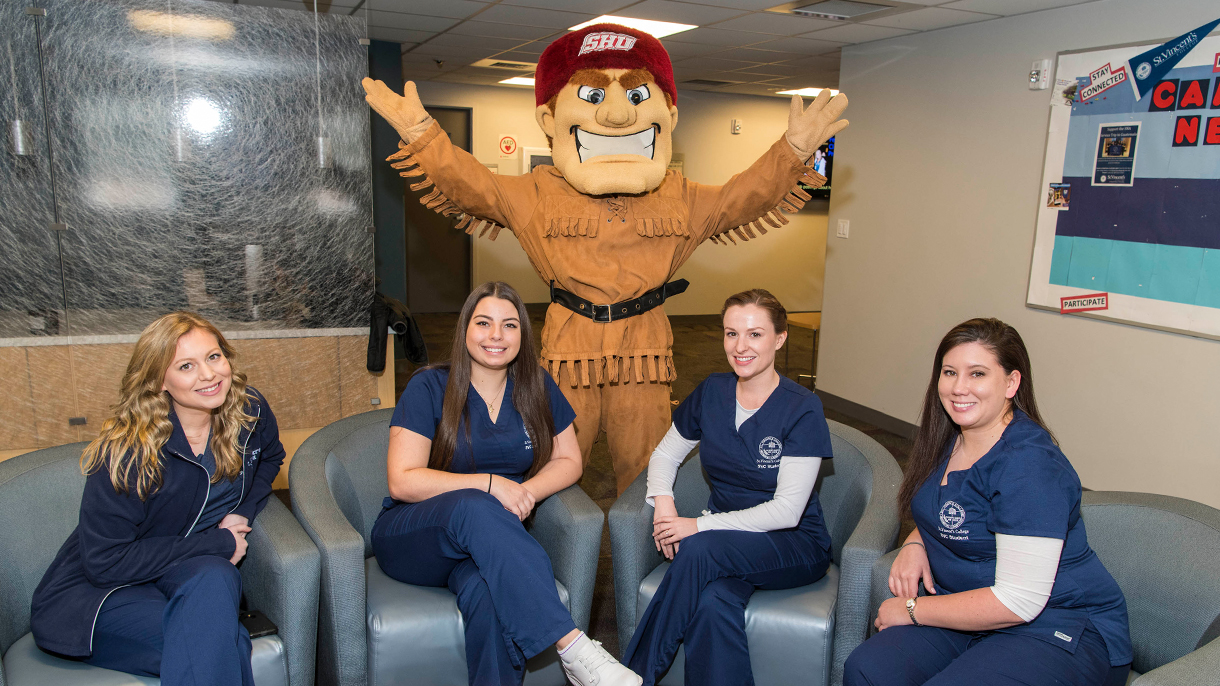 Nursing students with SHU's Big Red mascot