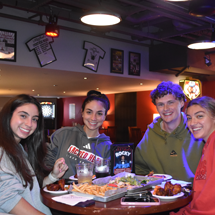 Students in Reds eating food
