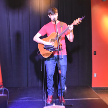 Man singing and playing guitar