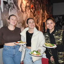 Students in Reds with nachos