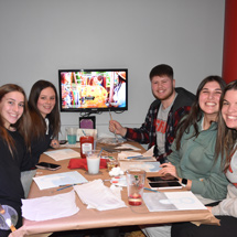 Students painting in Reds