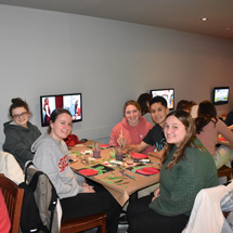 Students painting in Reds