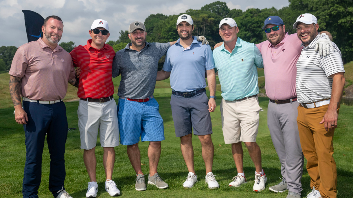 Golfers smiling at golf outing