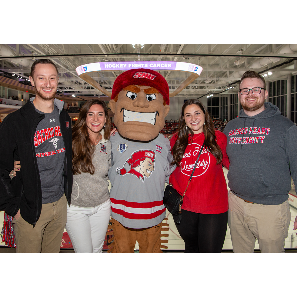 Big red with people at hockey game