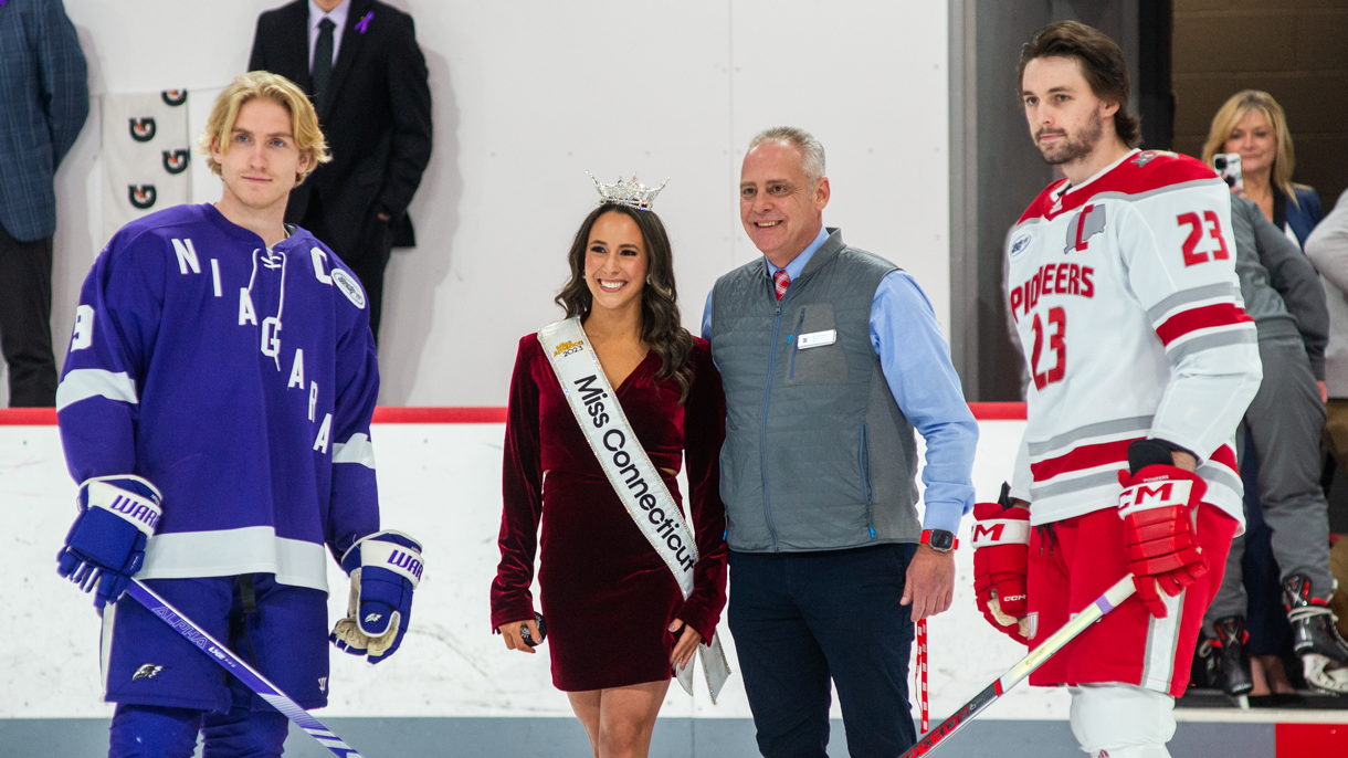 Miss Connecticut dropping the puck for a hockey game