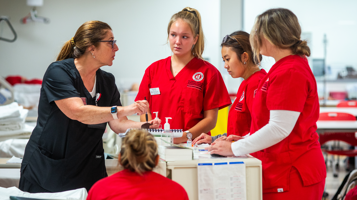Nursing students listening to professor