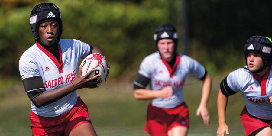 Women playing rugby