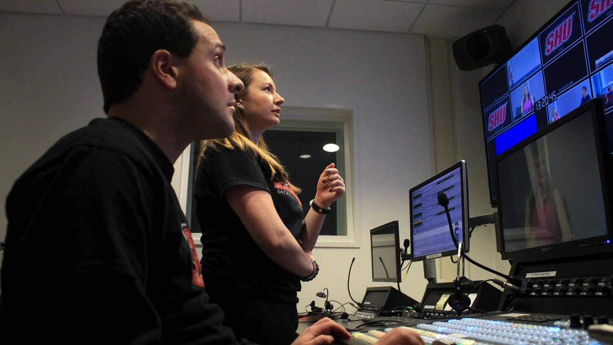 Woman and man in control room