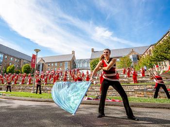 a color guard group performing with a band