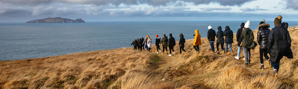 Students walking towards the water