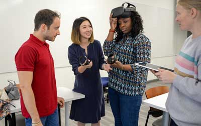 SCMA Professor and students using AR