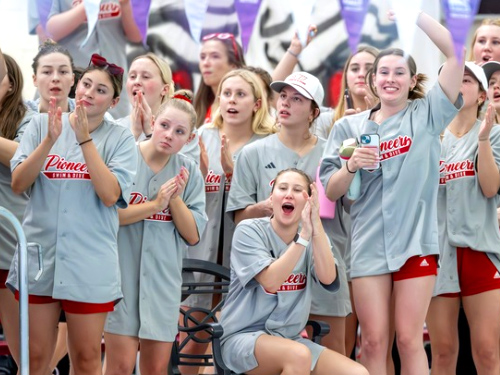 A swim team cheering