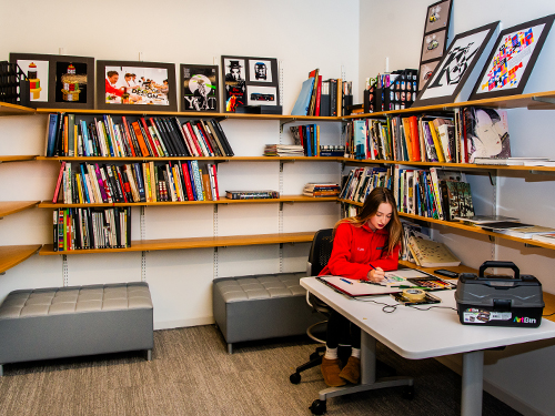 student working in an art library