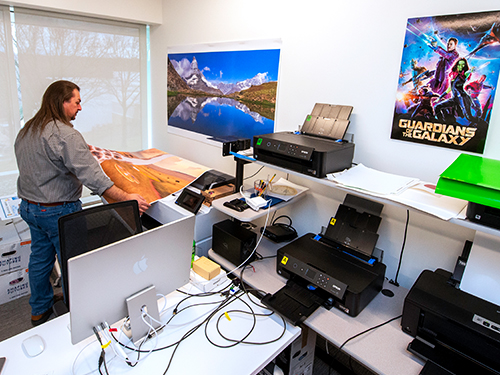 man printing a large format photo