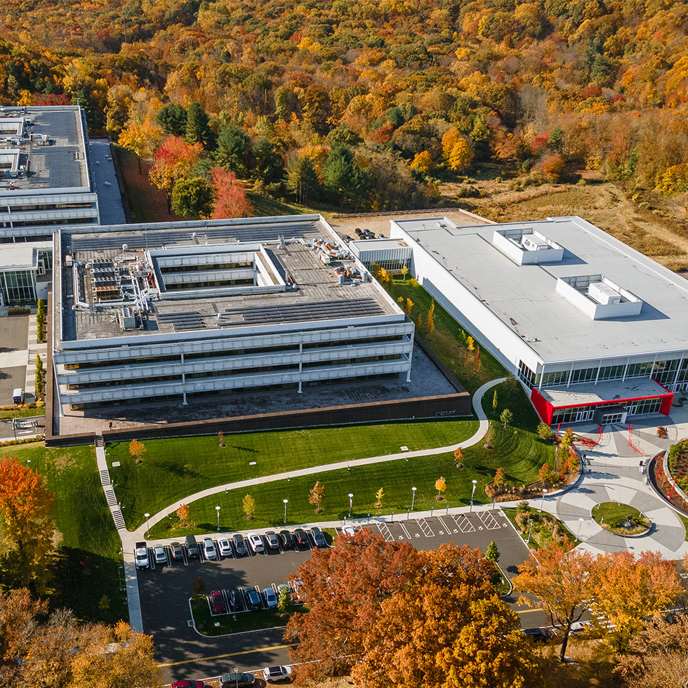Aerial view of Sacred Heart University's West Campus in the fall showing brightly colored foliage