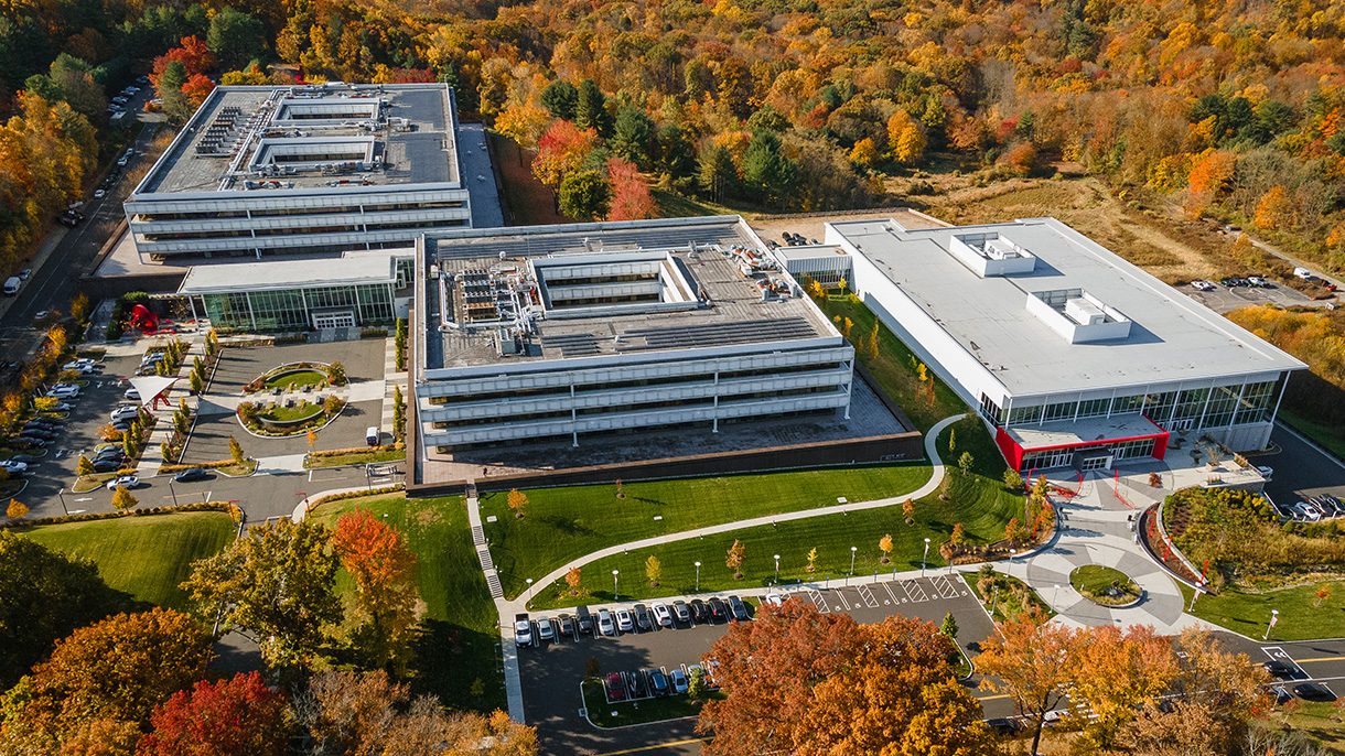 Aerial view of Sacred Heart University's West Campus in the fall showing brightly colored foliage