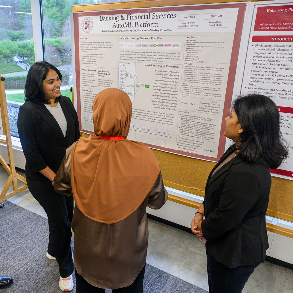 Students talking about research poster