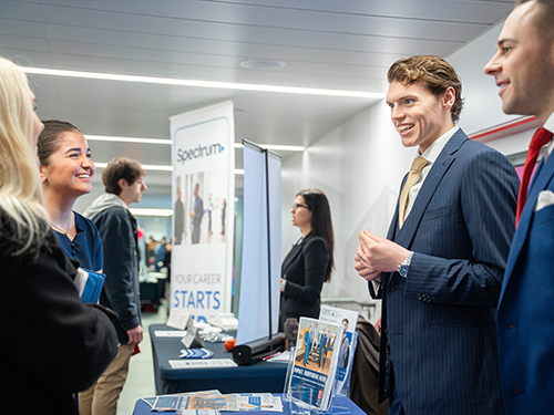 people connecting at a job fair