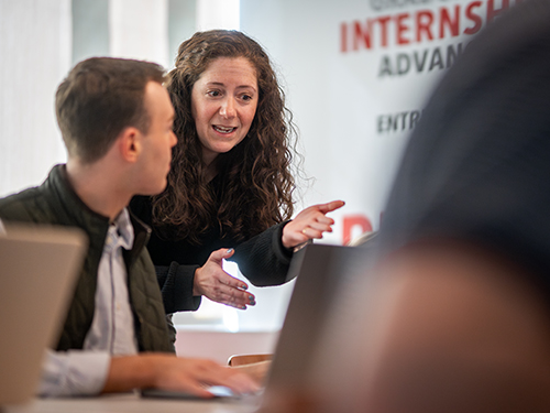 A career development counselor talking to a college student