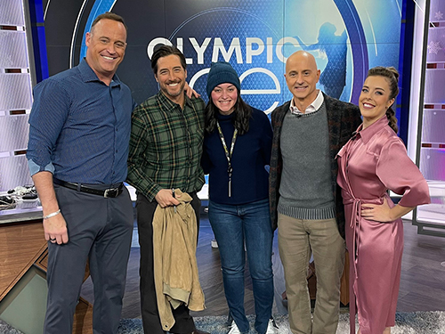group photo of people on the set of an NBC Olympic broadcast