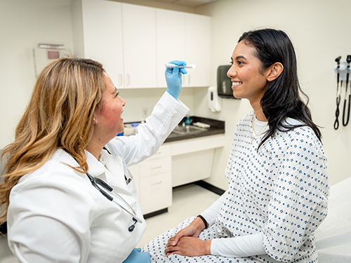 a physician assistant examining a patient