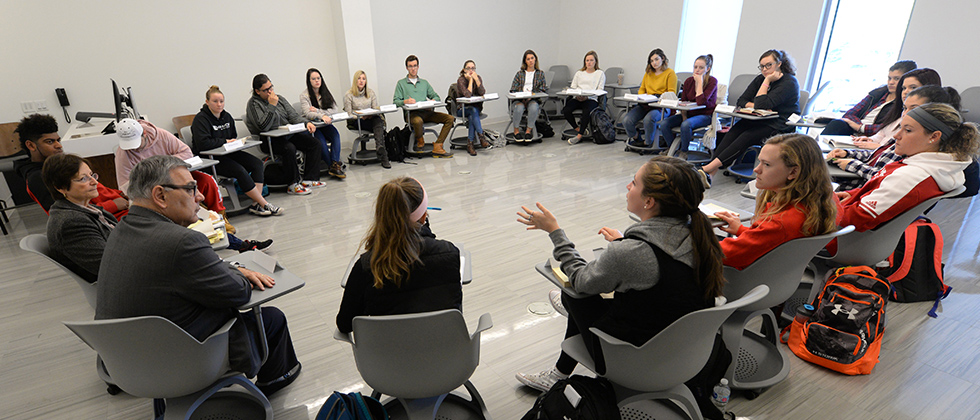 students having a discussion in class