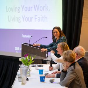 Panel of people talking at an event