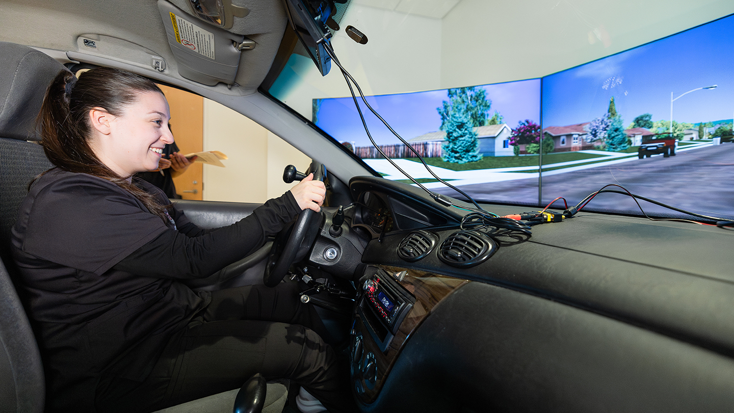 person in a driving simulator