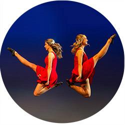 two Irish dancers jumping