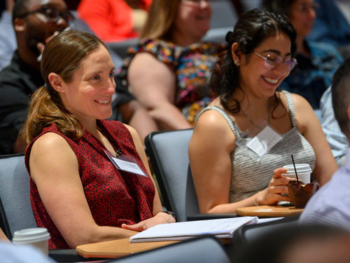 Women in audience smiling