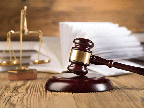 a gavel and a textbook 