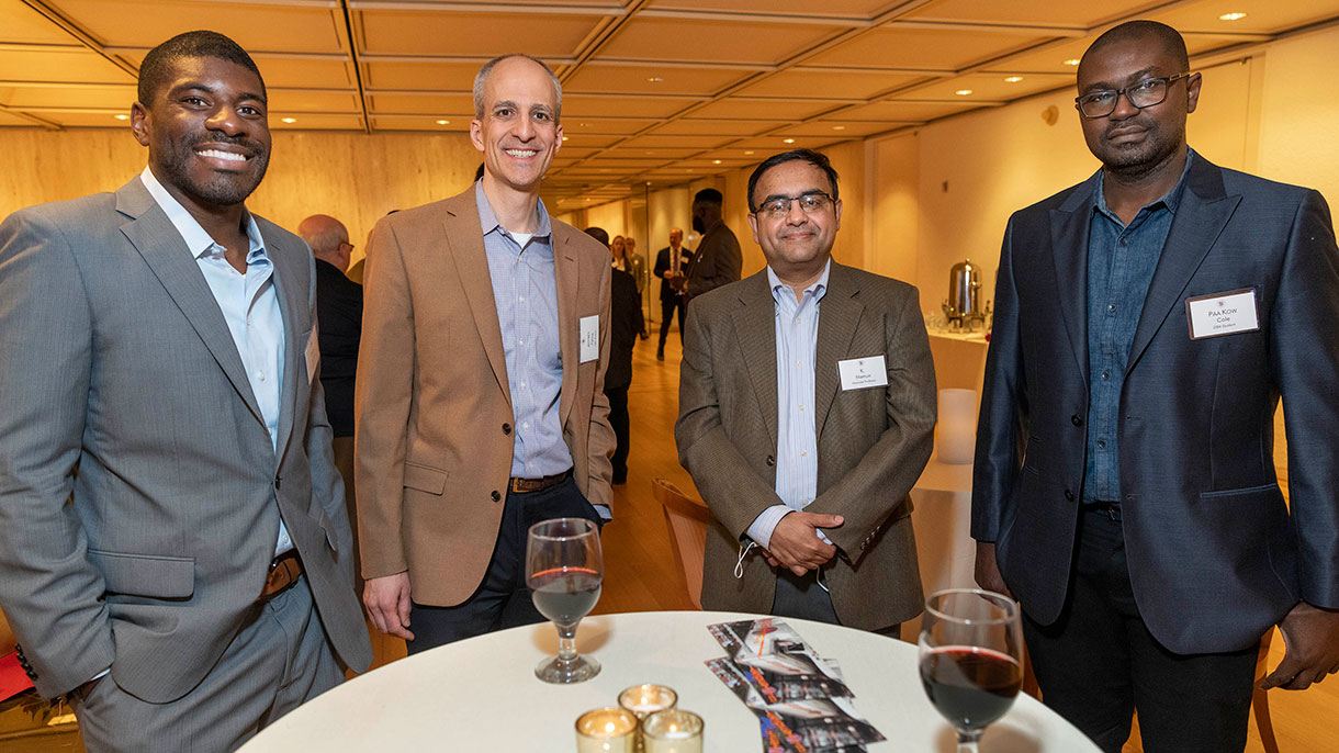 Students and faculty connecting at a DBA reception.