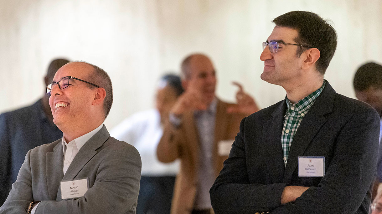 DBA alumni enjoy an event hosted by the Office of Alumni Engagement.