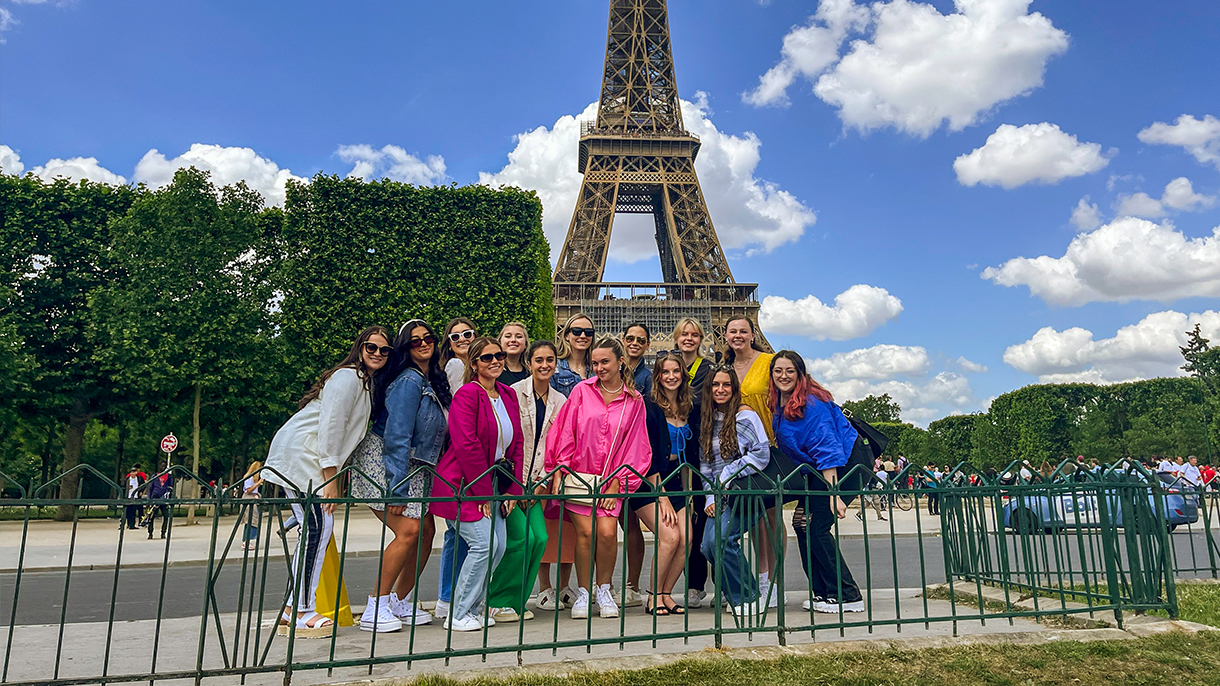 group photo of SHU students in front of the Eiffel Tower