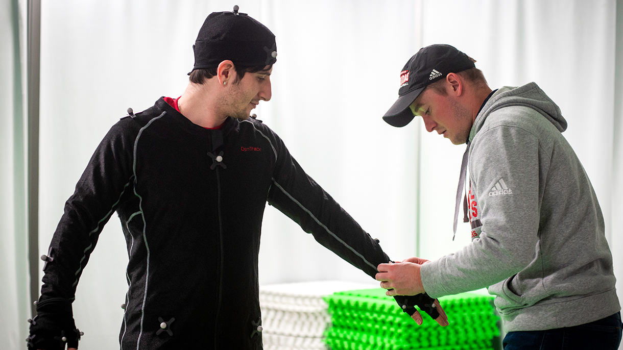 A student model puts on a motion capture suit