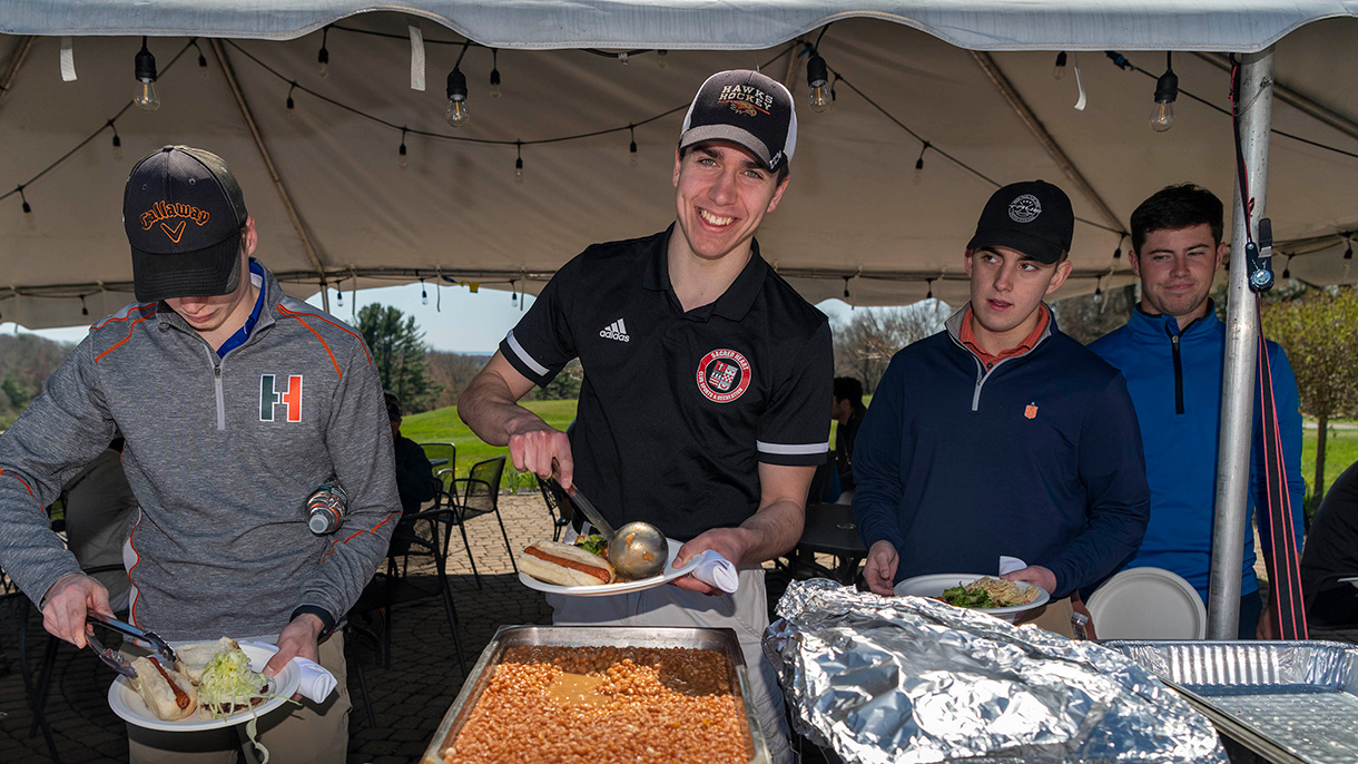 Golfers enjoy a delicious BBQ after the round.