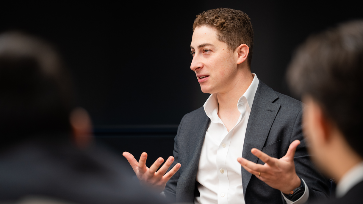 Business professional speaking to students