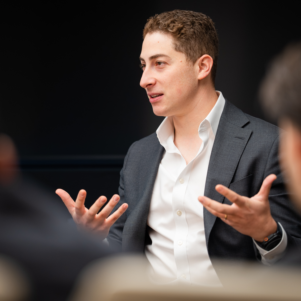 Business professional speaking to students