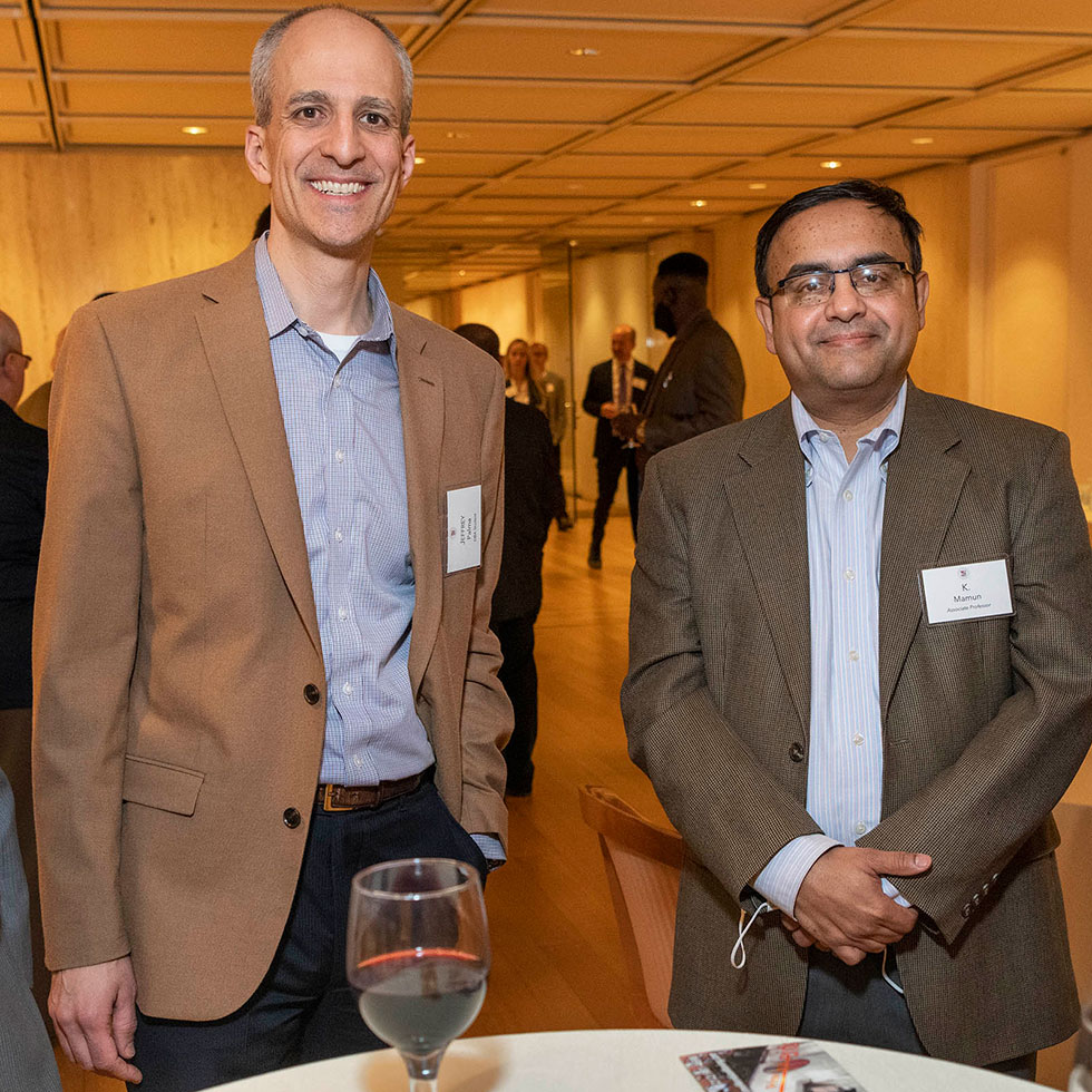 Students and faculty connecting at a DBA reception.