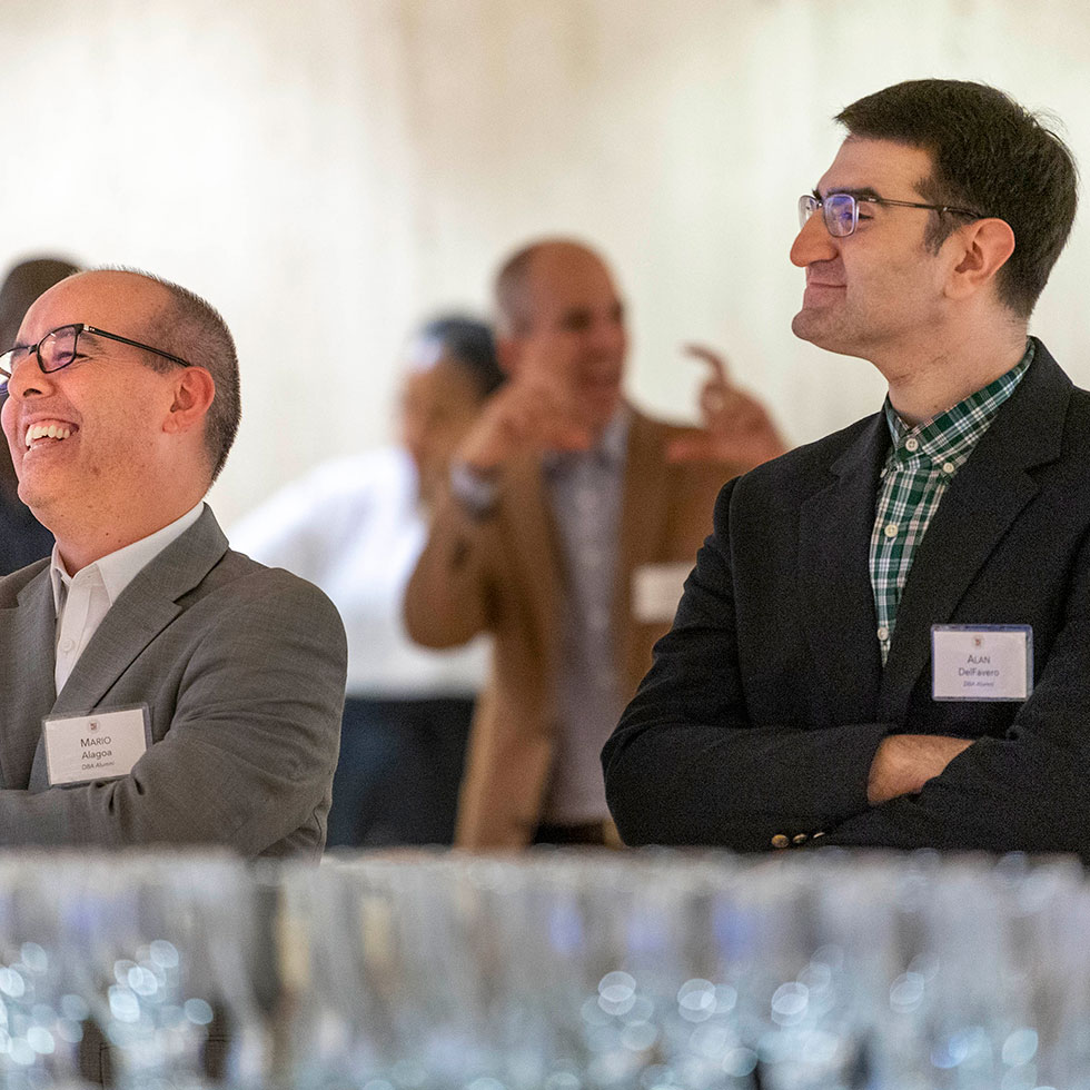 DBA alumni enjoy an event hosted by the Office of Alumni Engagement.
