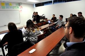 students listening to corporate presentation